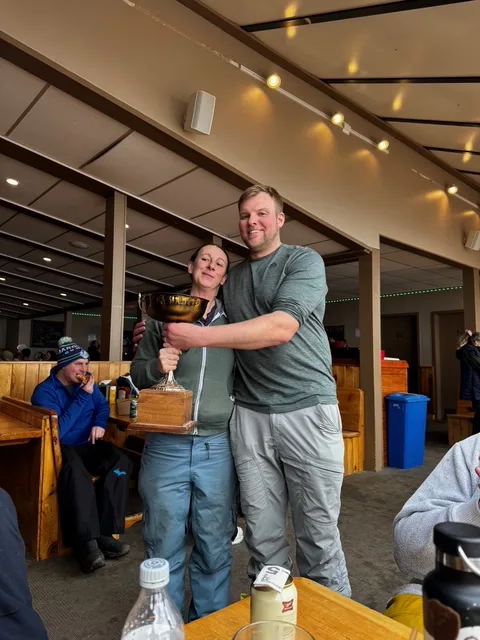 Two people in the Tbar hugging