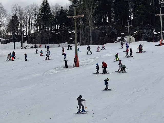 people skiing on the hill