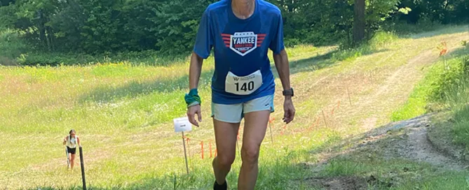 Woman Hiking uphill during rocket hill climb