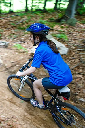 Girl Riding Bike On Forest Trails Girl Riding Bike On Forest Trails