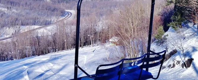 Chair lift at MMR with Lake Superior in the background