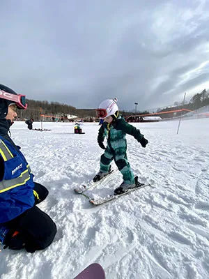 Child Learning To Ski